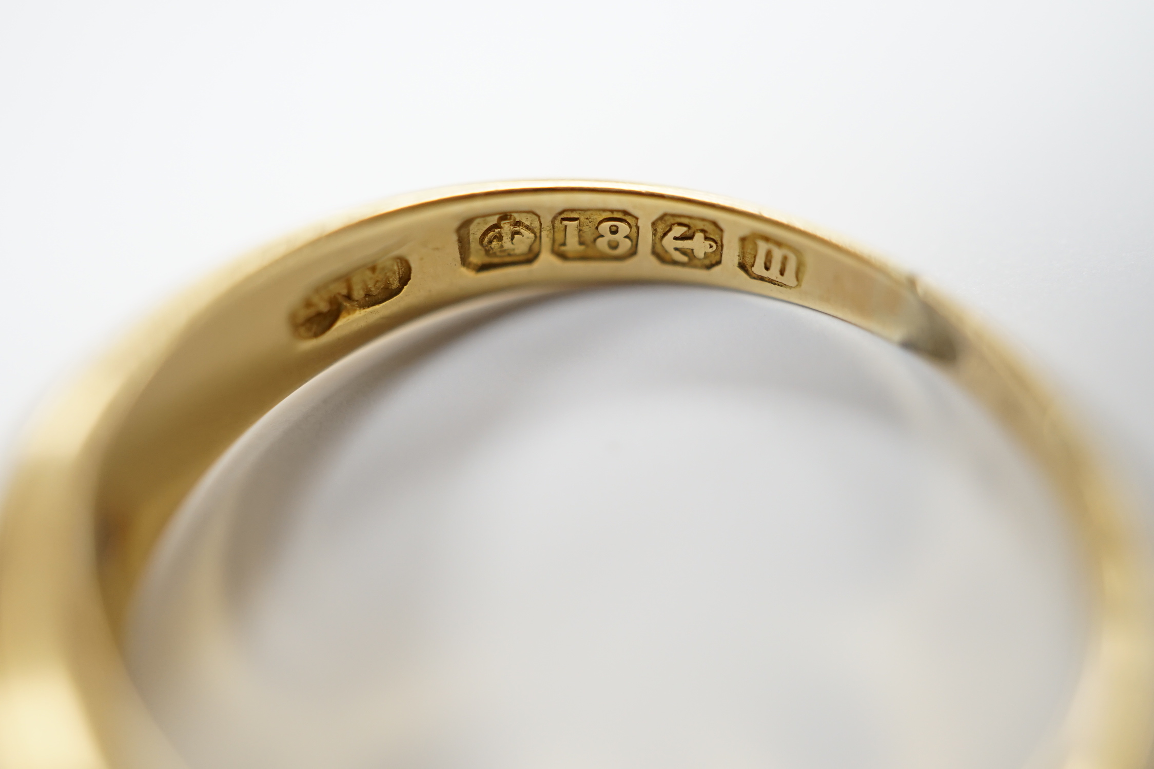 A George V 18ct gold, three stone sapphire and two stone diamond set half hoop ring, size N, gross weight 4 grams.